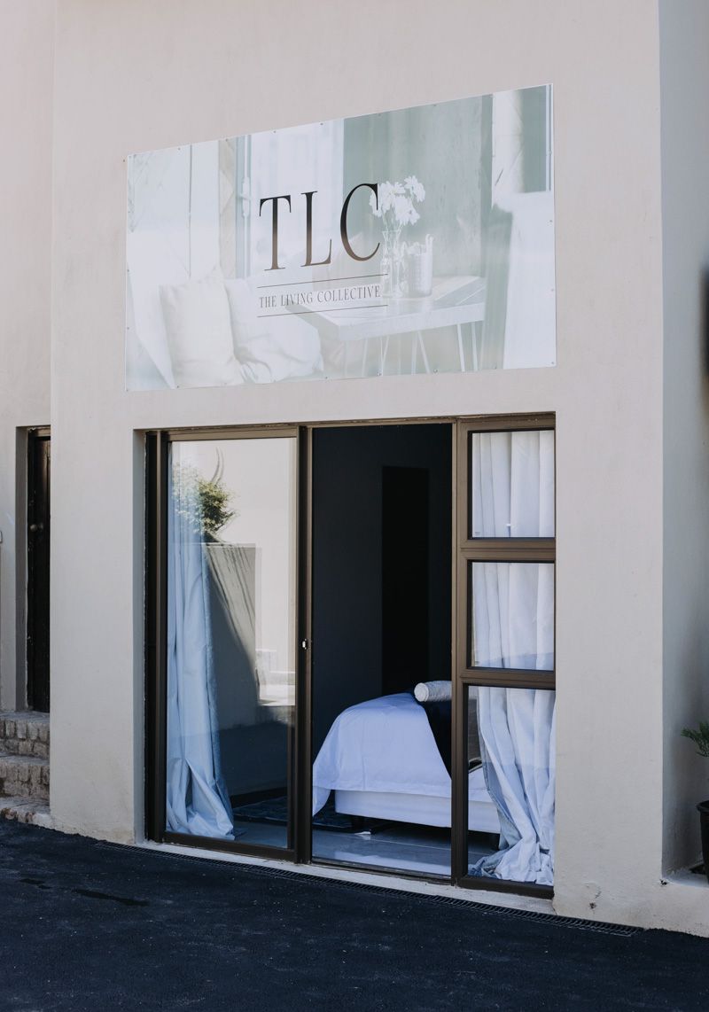The entrance to the cottage with the TLC name above the door