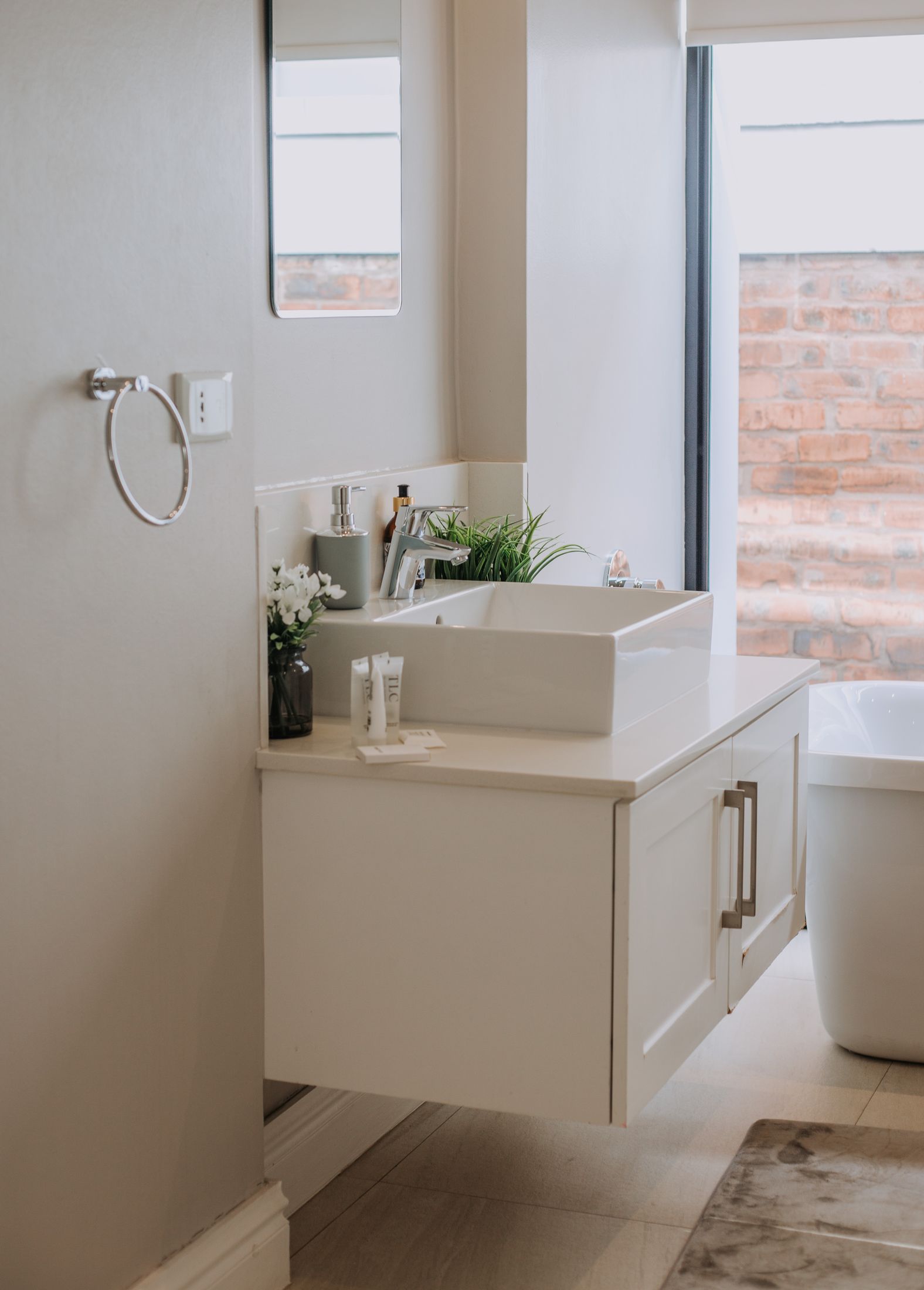 A floating white vanity in a Garlington bathroom
