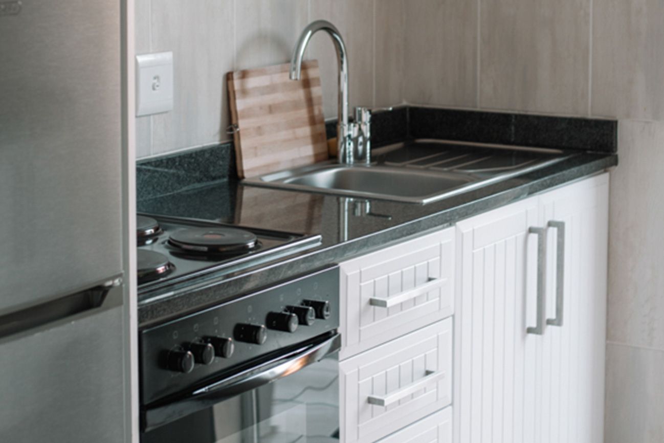 The loft kitchenette with a two plate stove and a sink