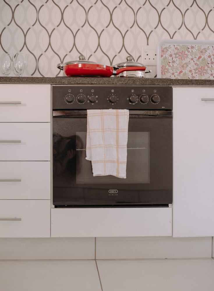 A four plate stove and oven with patterned tiles