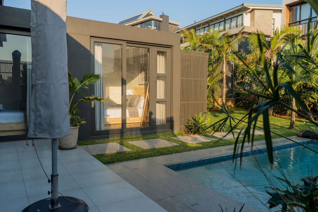 The pool and palms beside the house